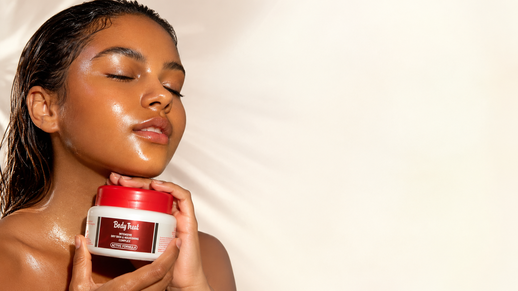 A woman with glowing skin holding a jar of Body Treat